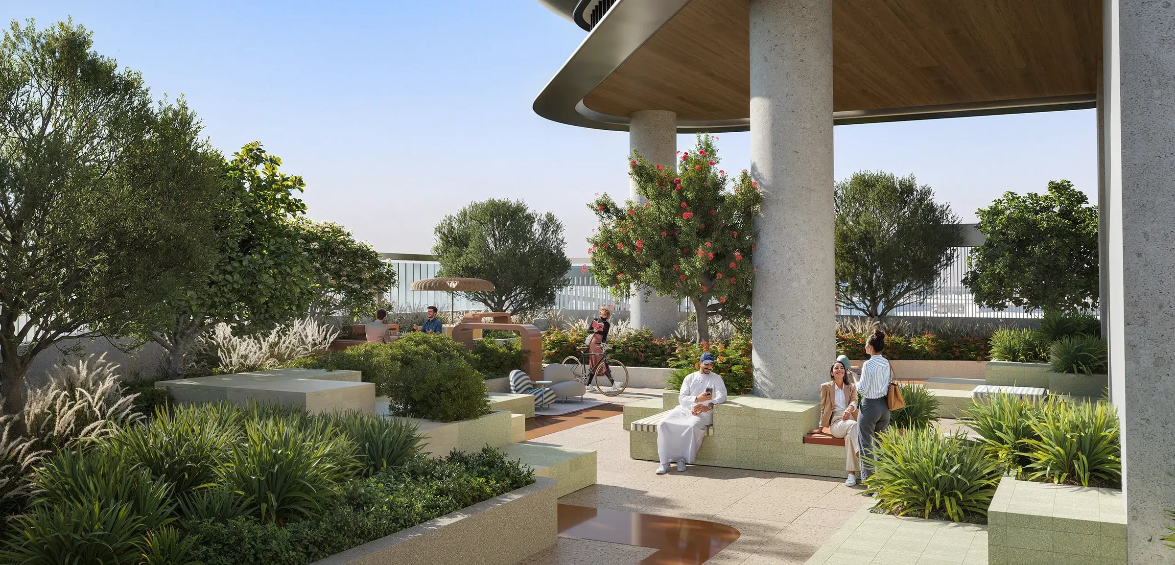 The podium garden terrace — flowering trees, stone seating and a view over the canal