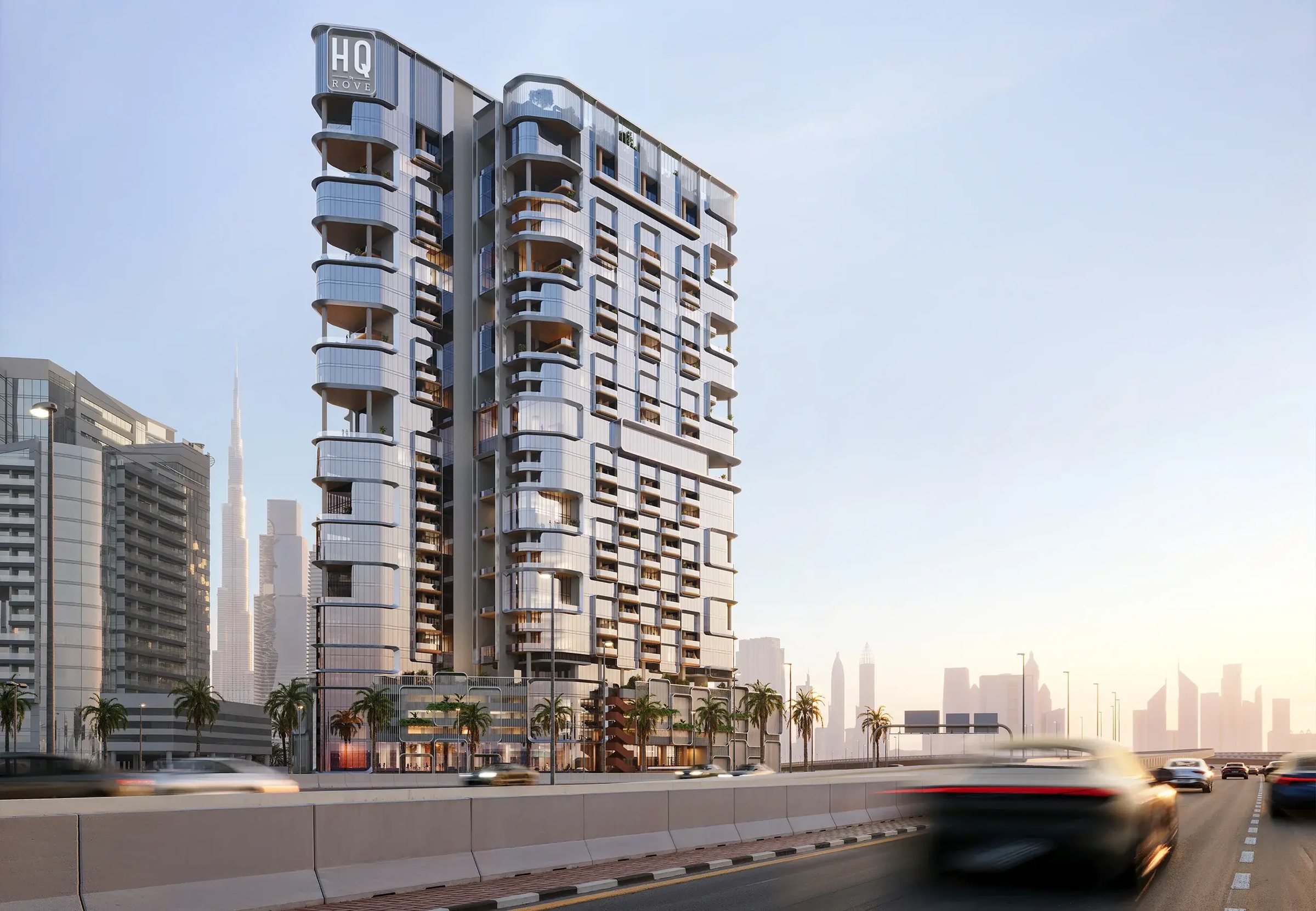 The HQ by Rove tower from street level — fluted cladding and curved glass pods above the canal road