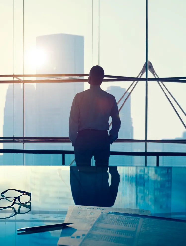 Executive in a glass-walled office