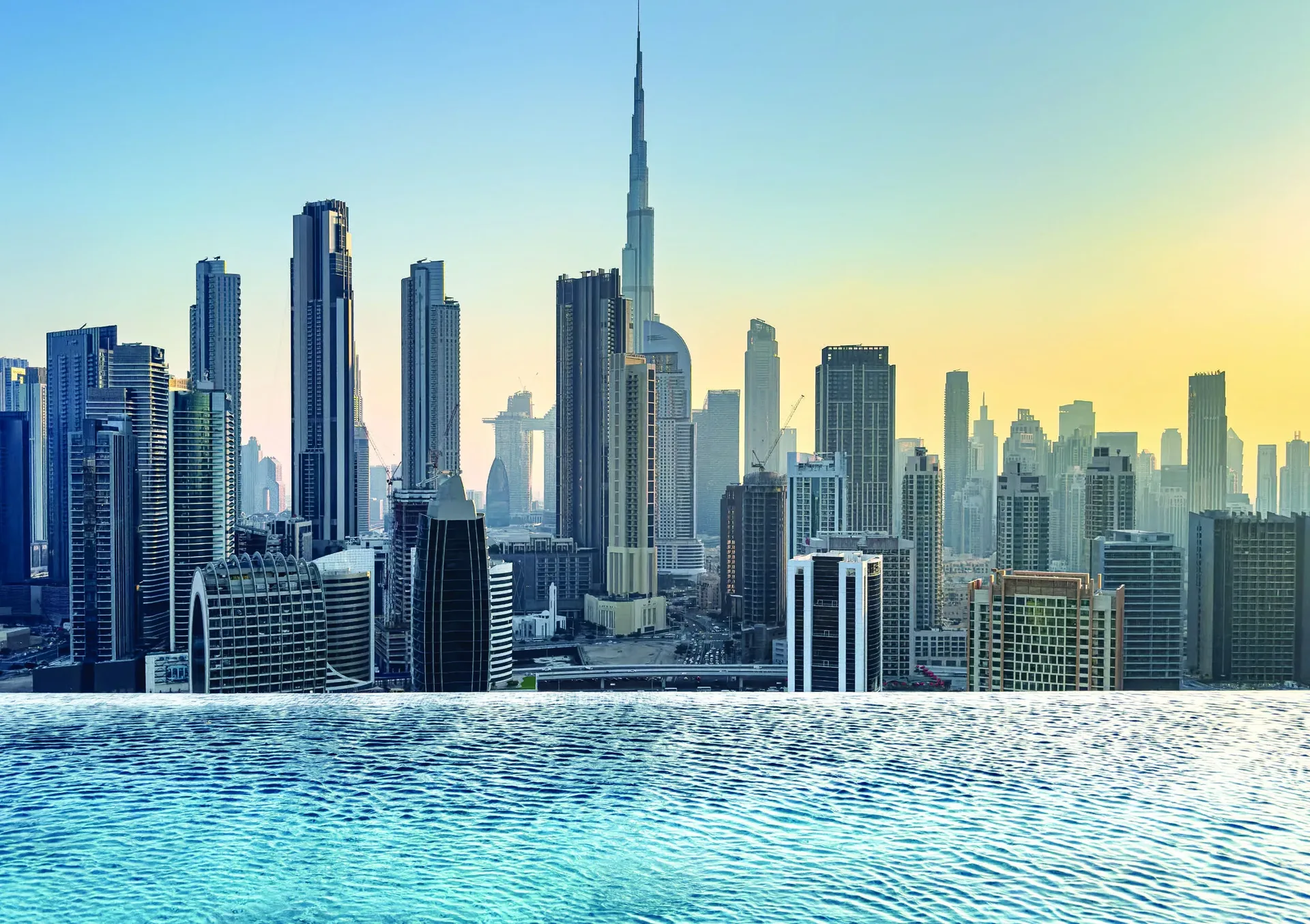 The Downtown Dubai skyline with Burj Khalifa seen across the water at dusk