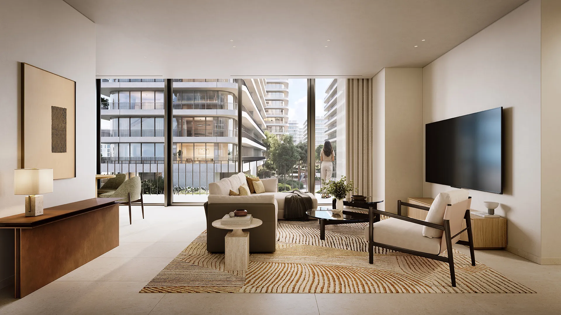 A living room opening onto the parkland through full-height glazing