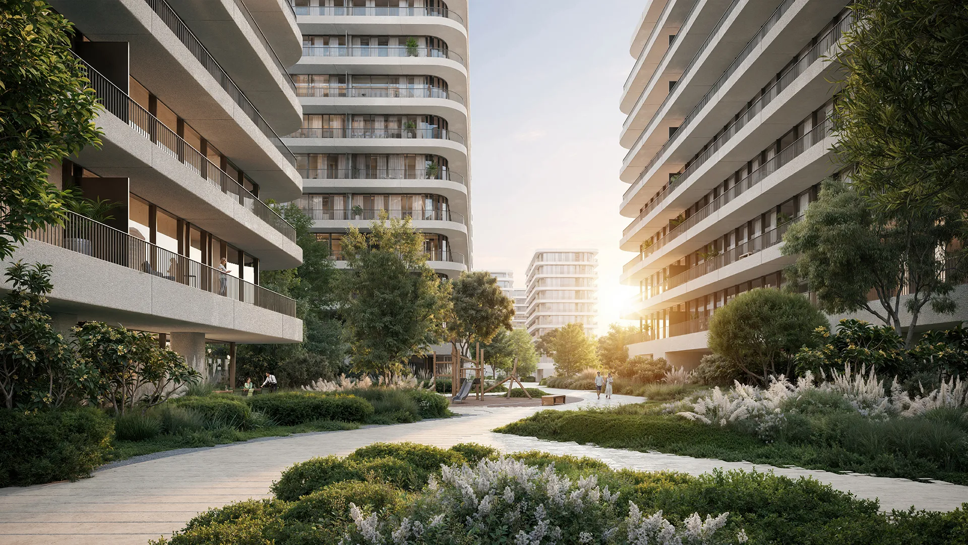 A garden path between the buildings at sunset