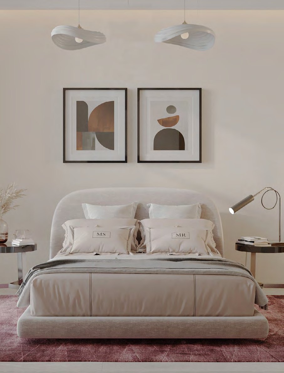 Bedroom in warm neutrals with pendant lights and framed prints