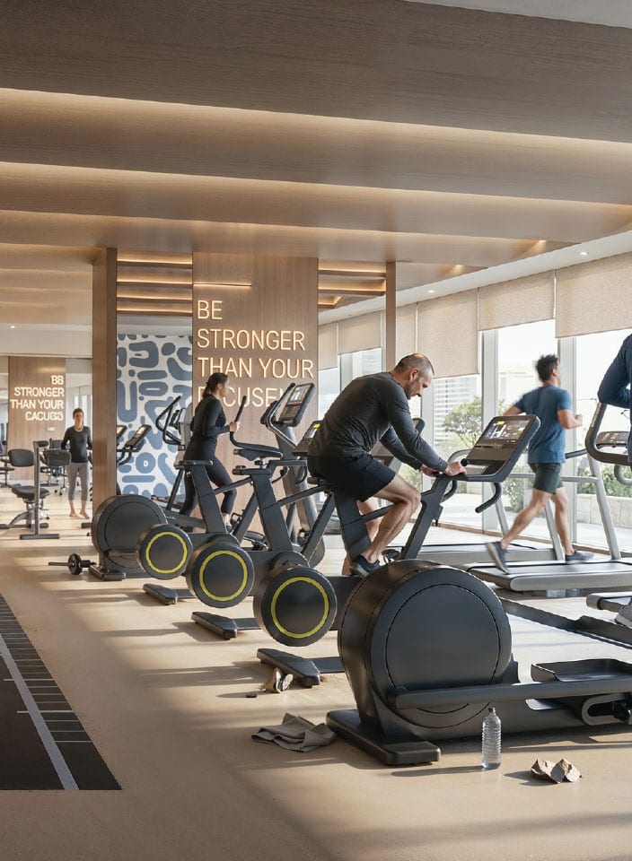 Residents' gym with treadmills and bikes in front of full-height glazing
