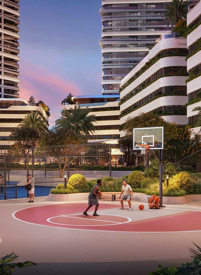 Half basketball court between the towers at dusk