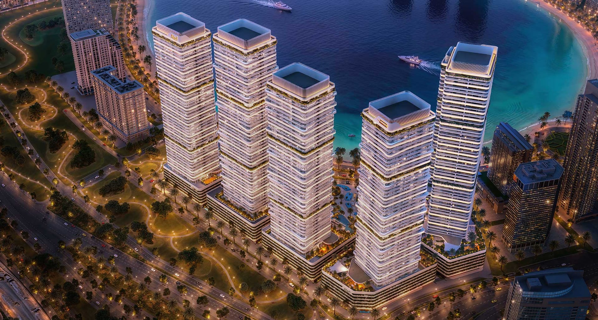 The six Linar towers lit at night on the Al Mamzar coastline