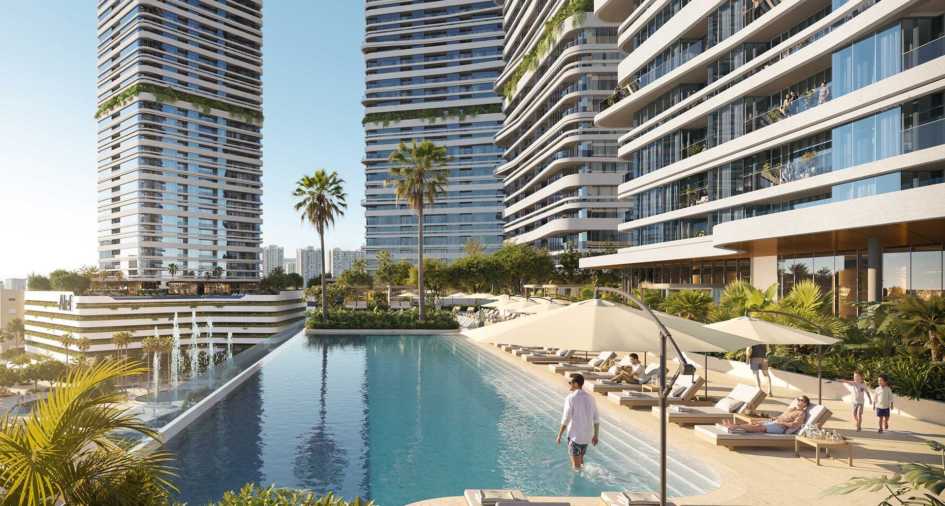 Pool deck between two Linar towers with residents at the water's edge