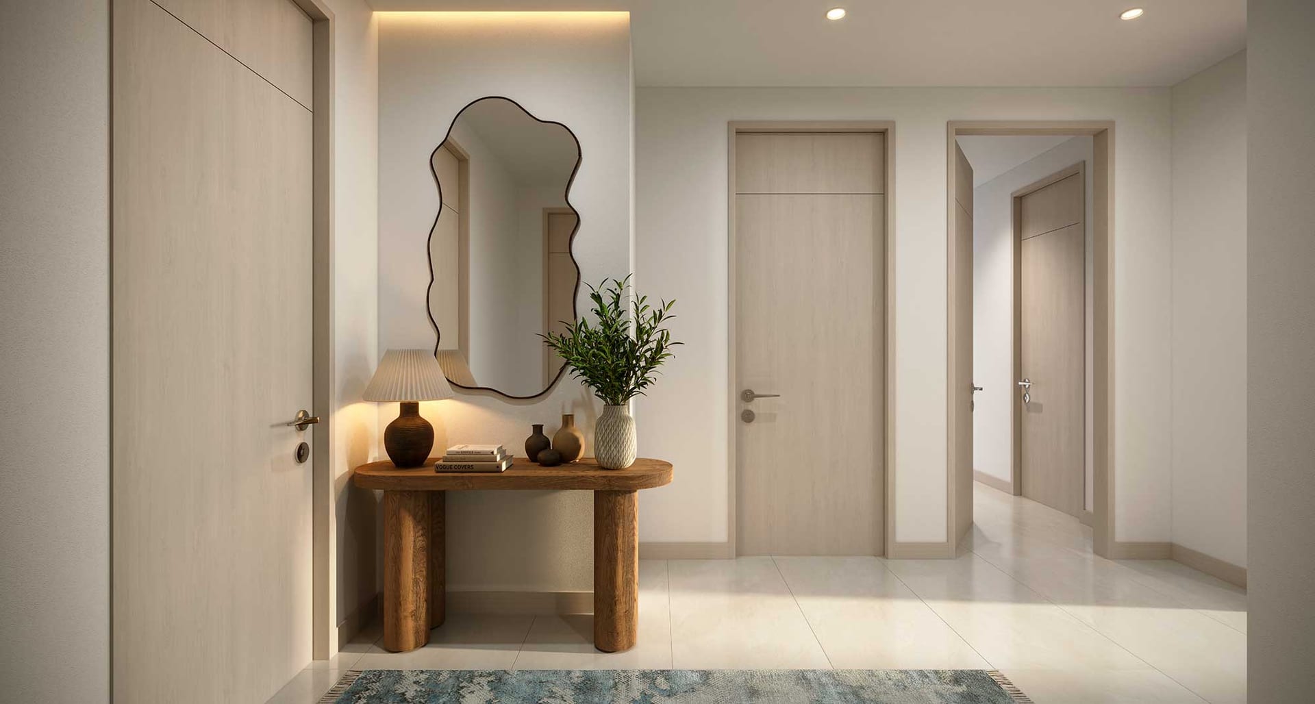Entrance hall with a sculpted mirror and console