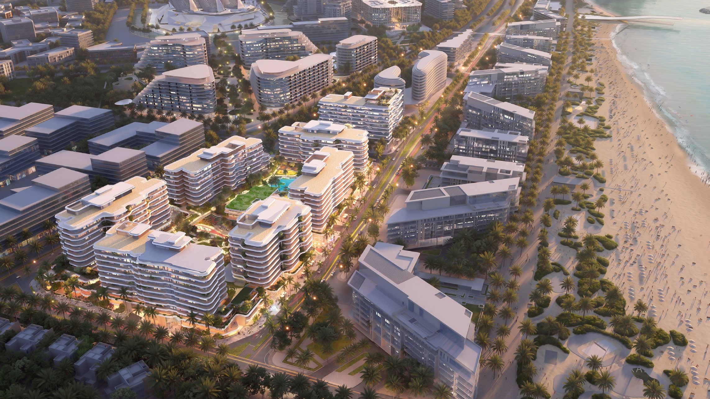 Mamsha Al Saadiyat from the air — the residences along the beach and the Saadiyat coastline at golden hour