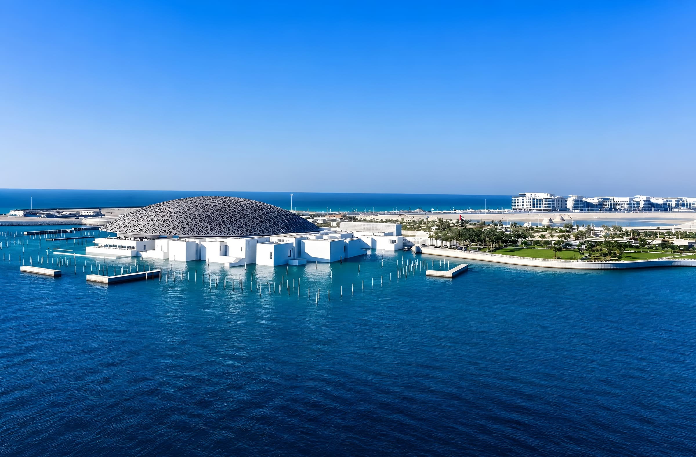 The Louvre Abu Dhabi dome on the water at Saadiyat Island, adjacent to the Marsa Al Saadiyat masterplan