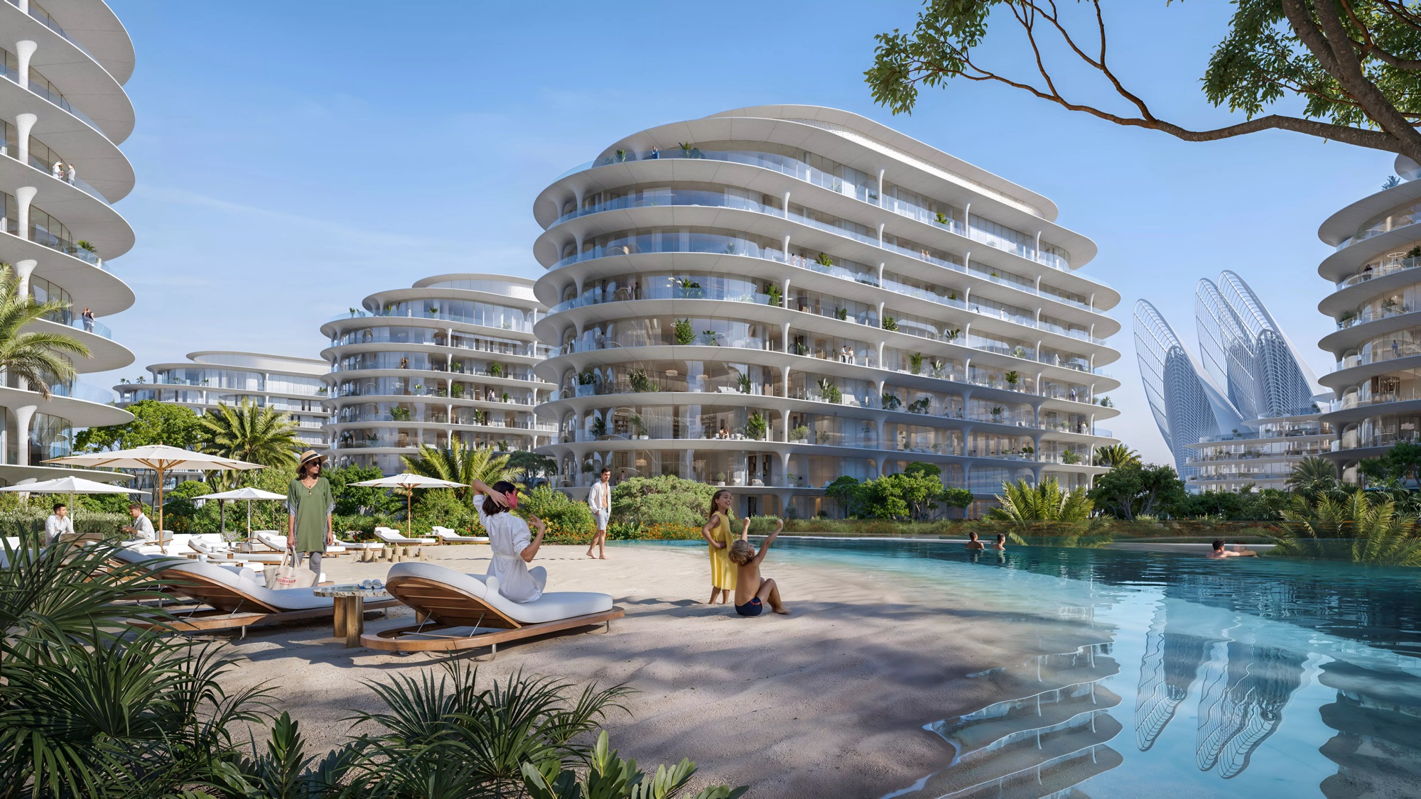 A lagoon pool at The Row Saadiyat with loungers, umbrellas and residents under tree canopy